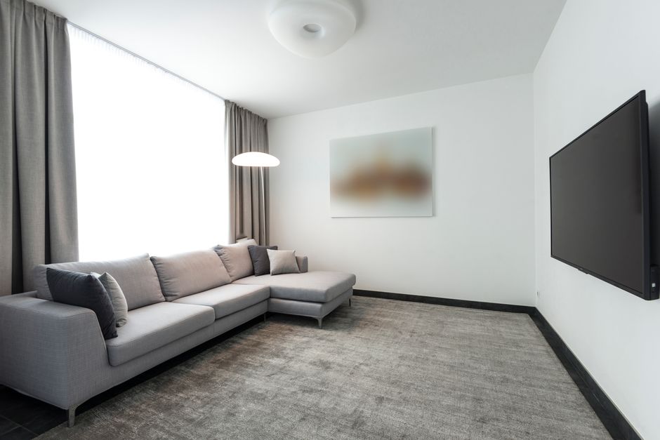 Kleine L-vorm woonkamer met slimme opslag. Kleine L-vorm woonkamer met slimme opslag.